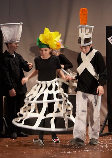 Flower headpieces out of lightweight coloured paper for a theatre production