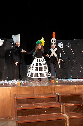 Flower headpieces out of lightweight coloured paper for a theatre production