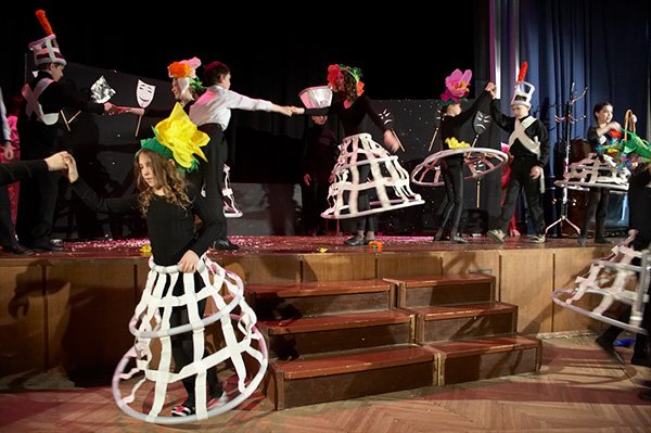 Flower headpieces out of lightweight coloured paper for a theatre production