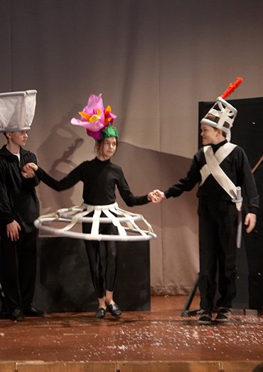 Flower headpieces out of lightweight coloured paper for a theatre production