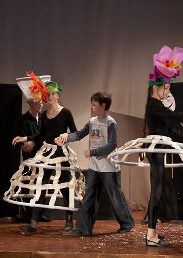 Flower headpieces out of lightweight coloured paper for a theatre production