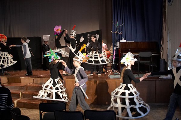Flower headpieces out of lightweight coloured paper for a theatre production