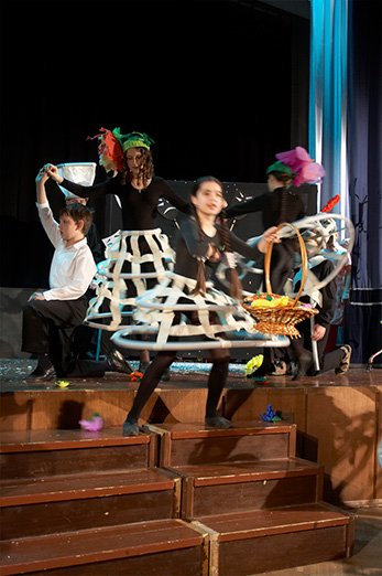 Flower headpieces out of lightweight coloured paper for a theatre production