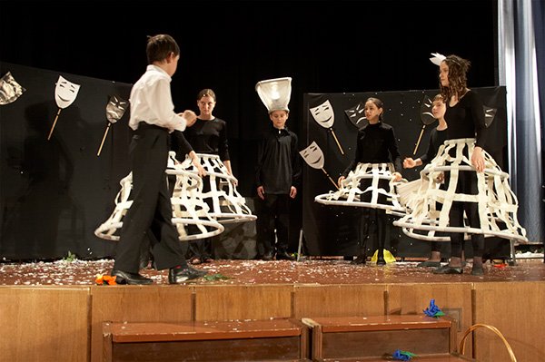 Flower headpieces out of lightweight coloured paper for a theatre production