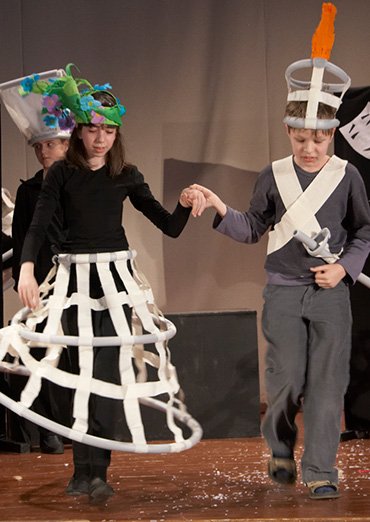 Flower headpieces out of lightweight coloured paper for a theatre production
