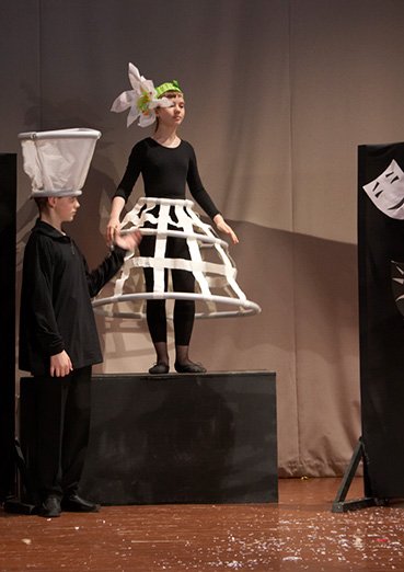 Flower headpieces out of lightweight coloured paper for a theatre production
