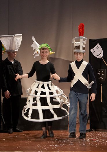 Flower headpieces out of lightweight coloured paper for a theatre production